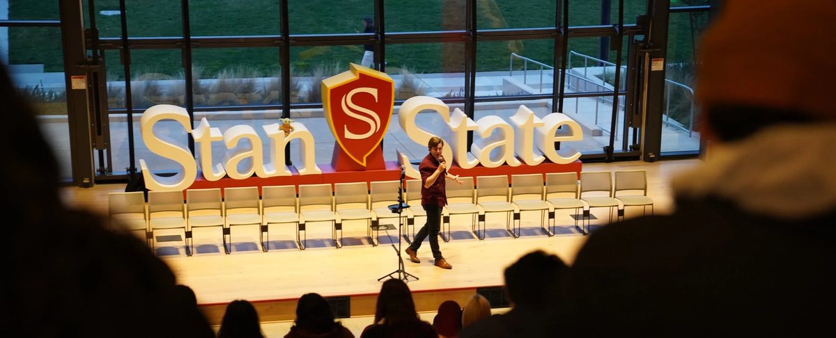 Reed performing on stage at Stan State